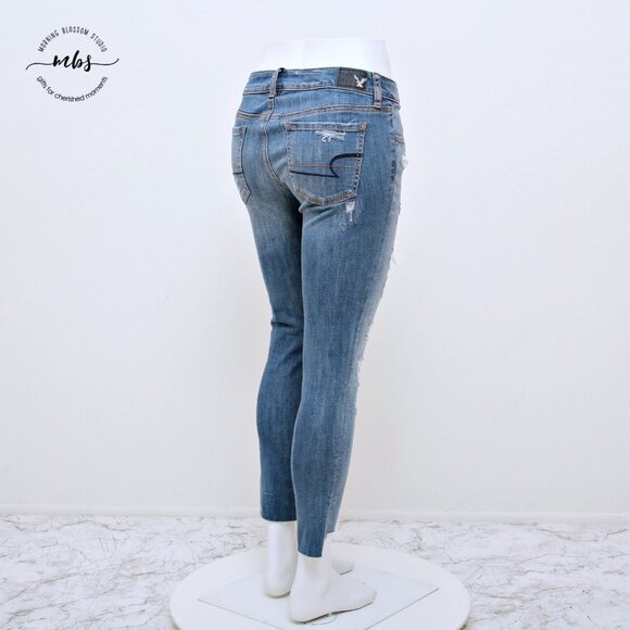 American Eagle Super Stretch Low Waist Distressed Raw Hem Jeggings - Picture 5 of 14